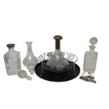 Four glass decanters with stoppers