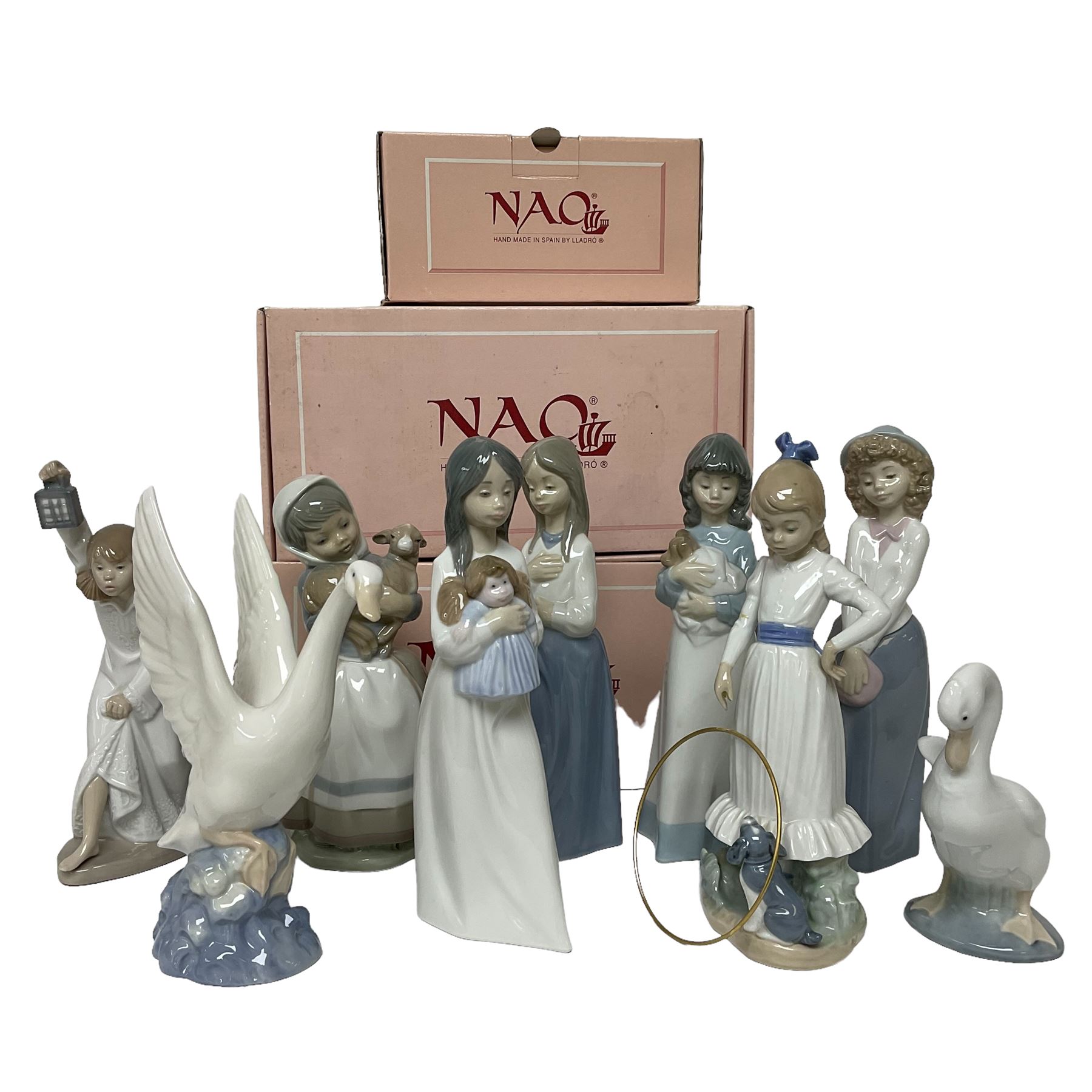 Collection of nine Nao figures