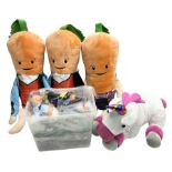 Three large ALDI Kevin carrots and giant unicorn stuffed toy together with quantity of smaller carro