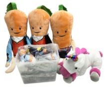 Three large ALDI Kevin carrots and giant unicorn stuffed toy together with quantity of smaller carro