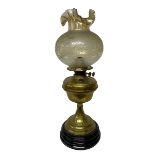 Brass oil lamp with frilled glass shade