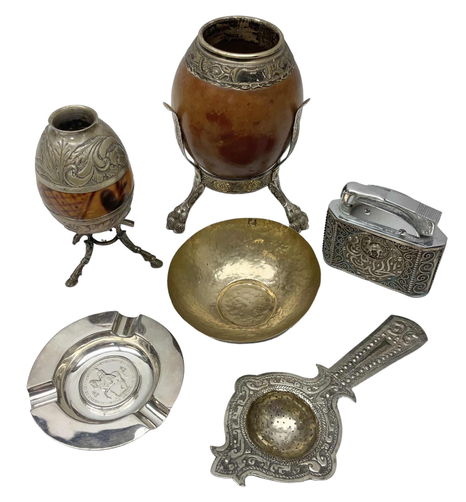 Yerba mate tea gourd calabash cup with silver-plated foliate mounts raised upon three hoof feet