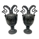 Pair of late 19th century continental black glazed urn shaped two-handled vases with classical style