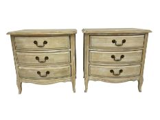 Pair washed finish bow-front bedside chests