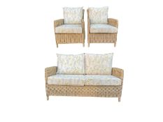 Three piece conservatory suite - cane two seat sofa and pair matching armchairs upholstered in Laura