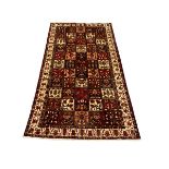 Persian Bakhtiari burgundy and ivory ground rug