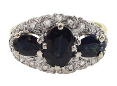 18ct gold three stone oval sapphire and diamond cluster ring