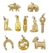 Ten 9ct gold pendant/charms including west highland terrier