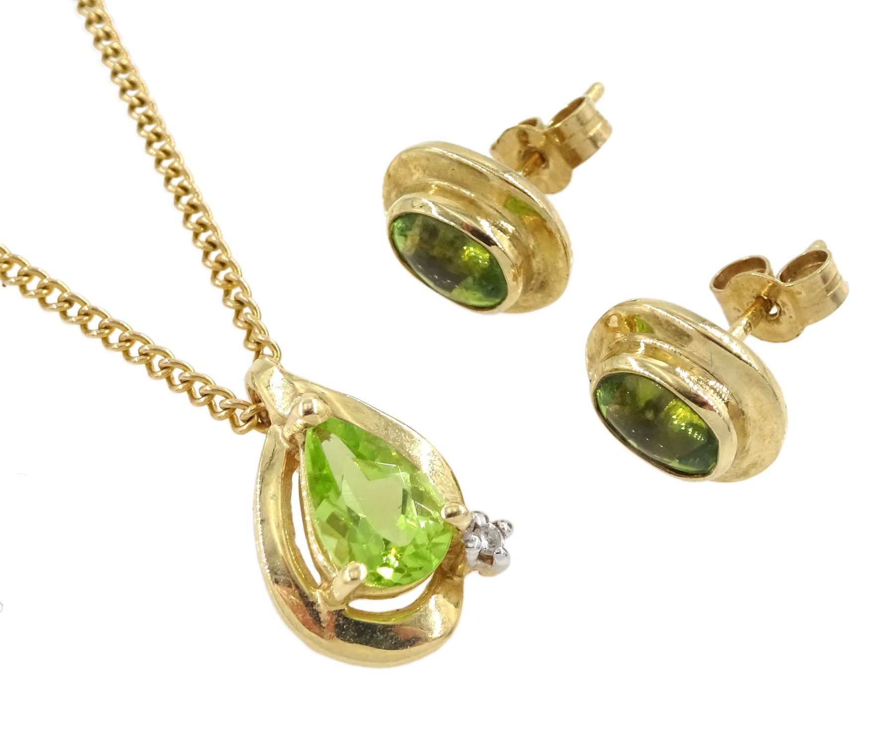 Pair of gold oval peridot stud earrings and a pear shaped peridot and diamond pendant necklace