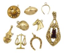 Two 17ct gold charms including sombrero and violin