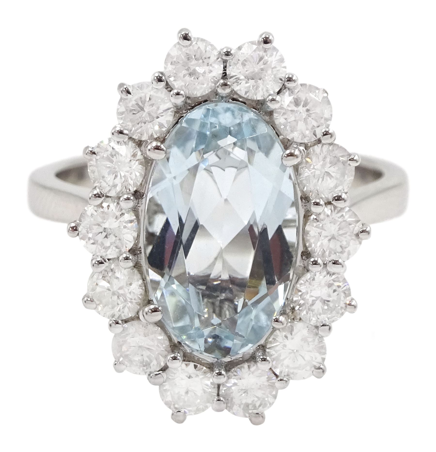 18ct white gold oval aquamarine and round brilliant cut diamond cluster ring