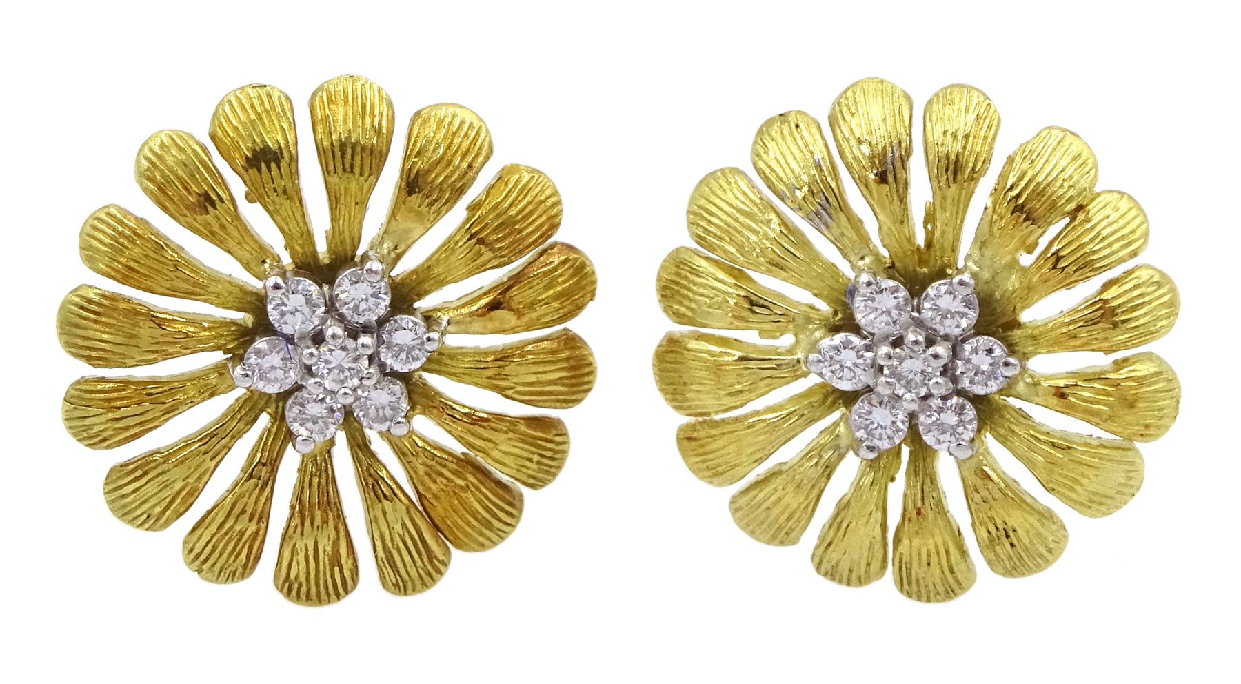 Pair of 18ct gold round brilliant cut diamond daisy stud earrings