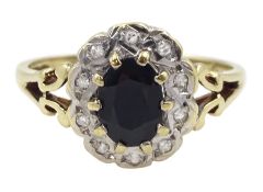 9ct gold oval sapphire and diamond cluster ring with pierced shoulders