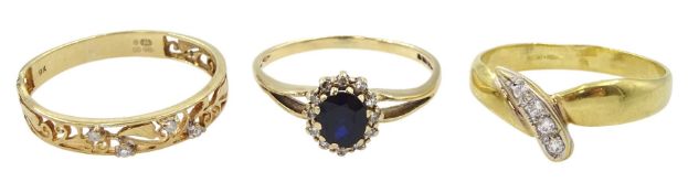 Gold diamond set openwork ring and a gold sapphire and diamond cluster ring