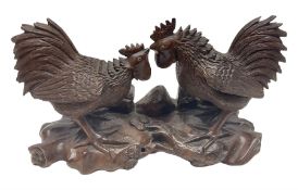 Pair of Japanese Meiji carved hardwood fighting cockerels