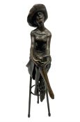 Art Deco style bronze modelled as a female figure seated cross legged upon a chair