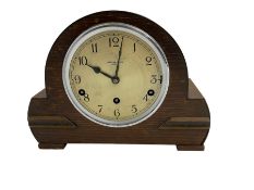 Westminster chiming mantle clock in an oak cases