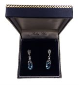 Pair of silver blue stone and marcasite pendant stud earrings