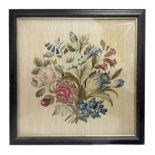 Framed needlework of a bunch of flowers in glazed frame