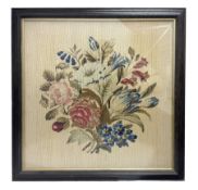 Framed needlework of a bunch of flowers in glazed frame