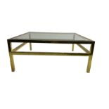 Brass framed coffee table fitted with bevelled glass top and undertier