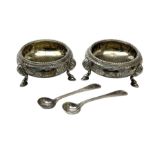 Pair of Victorian silver table salt cellars of cauldron form with gilt interiors