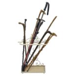 Quantity of walking sticks and cream finish stand