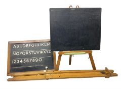 Two freestanding blackboards with easel type stands