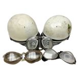 Two Geno Paris small size motorcycle helmets; and three pairs of goggles