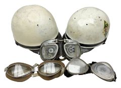 Two Geno Paris small size motorcycle helmets; and three pairs of goggles