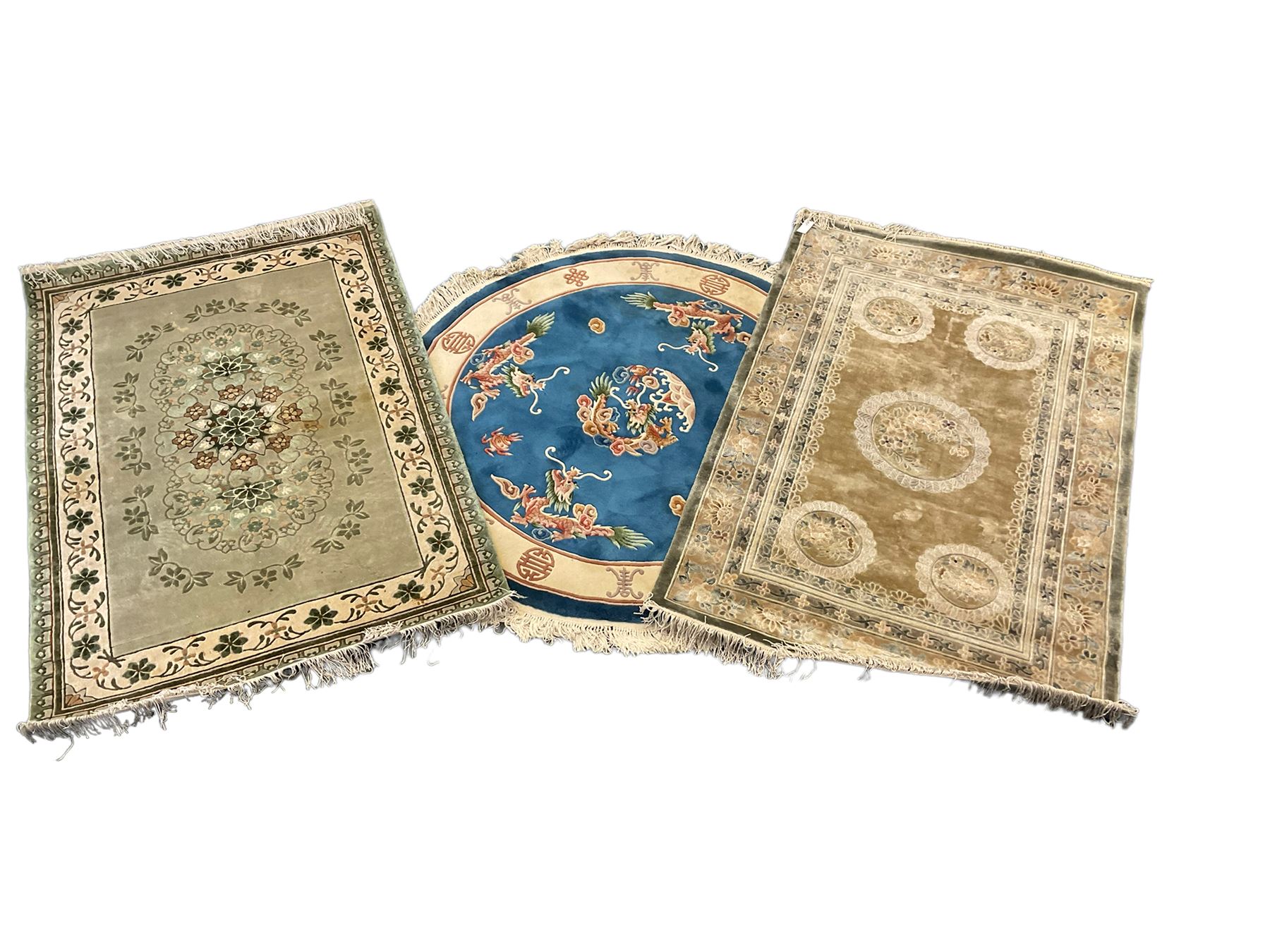 Three Chinese washed woollen rugs - circular blue ground decorated with dragons (D160cm)
