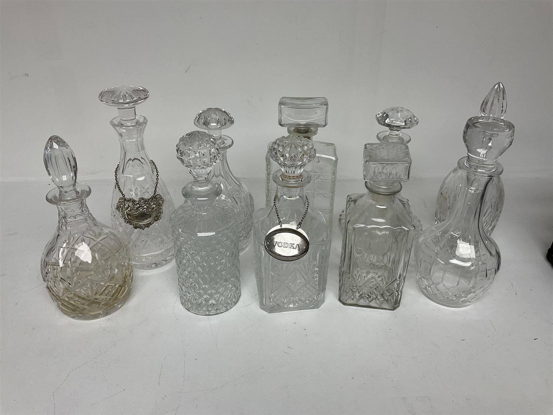 Ten decanters to include an I.W. Harper example of concave square form and two examples with tags - Image 3 of 4