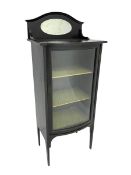 Early 20th century ebonised bow-front cabinet. raised back with oval bevelled mirror