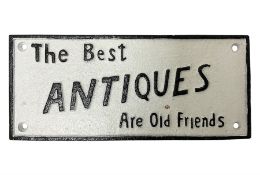 Cast iron sign 'The Best Antiques Are Old Friends'