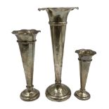 Three hallmarked silver trumpet vases with frilled rims and weighted bases