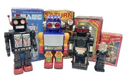 Three vintage battery operated robots comprising tin-plate Space Walk Man ME 100 Robot
