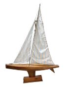 Large pond yacht with simulated planked mahogany deck