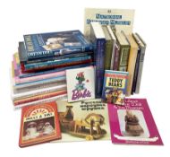 Over twenty reference books on dolls including Barbie and other fashion dolls etc