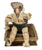 Modern reproduction automaton in the form of a baby doll in a basket clothed in Victorian style lace