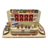 Late 1950s continental red and white painted wooden diorama of a grocery shop interior with fitted s