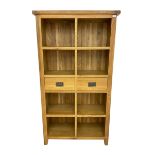 Light oak eight compartment bookcase with two drawers