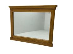 Light oak framed rectangular wall mirror