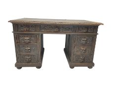 Late 19th century Gothic revival carved oak twin pedestal desk