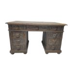 Late 19th century Gothic revival carved oak twin pedestal desk