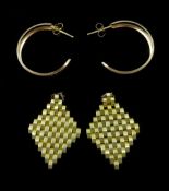 Pair of gold hoop earrings and a pair of gold tassel earrings
