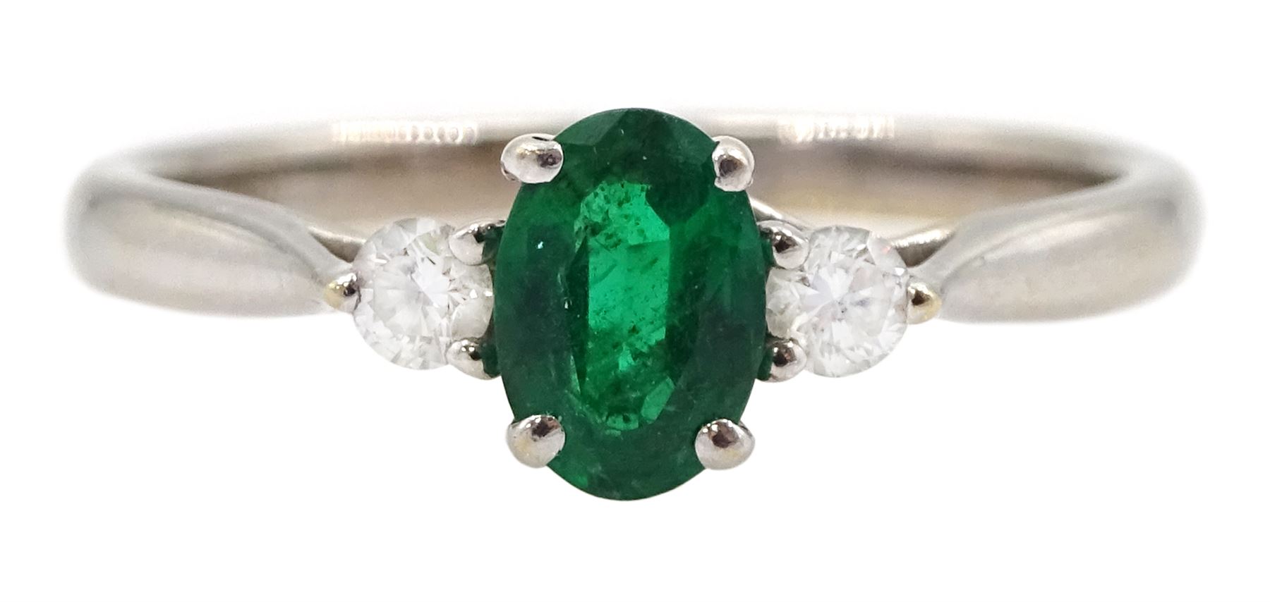 18ct white gold three stone oval emerald and round brilliant cut diamond ring