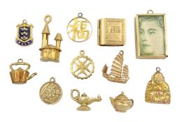 Nine 9ct gold pendant/charms including money box