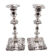 Pair of Edwardian silver mounted candlesticks