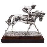 Modern silver model of a racehorse with mounted jockey