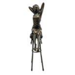 Art Deco style bronze modelled as a female figure seated upon a chair